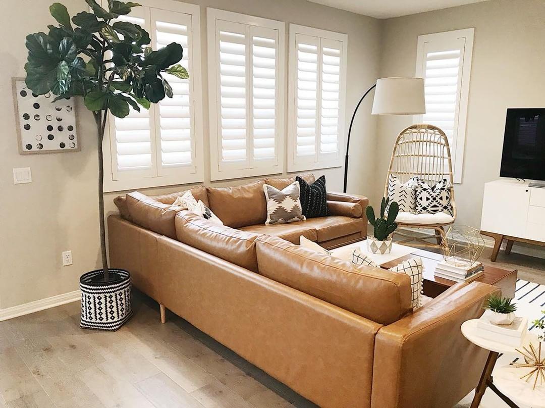 Warm living room with Polywood shutters in Charlotte.